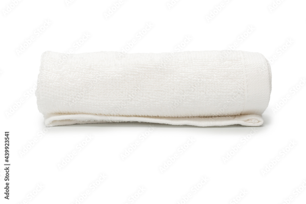 White fluffy cotton towel isolated on a white background. White fluffy cotton towel isolated on a white background.