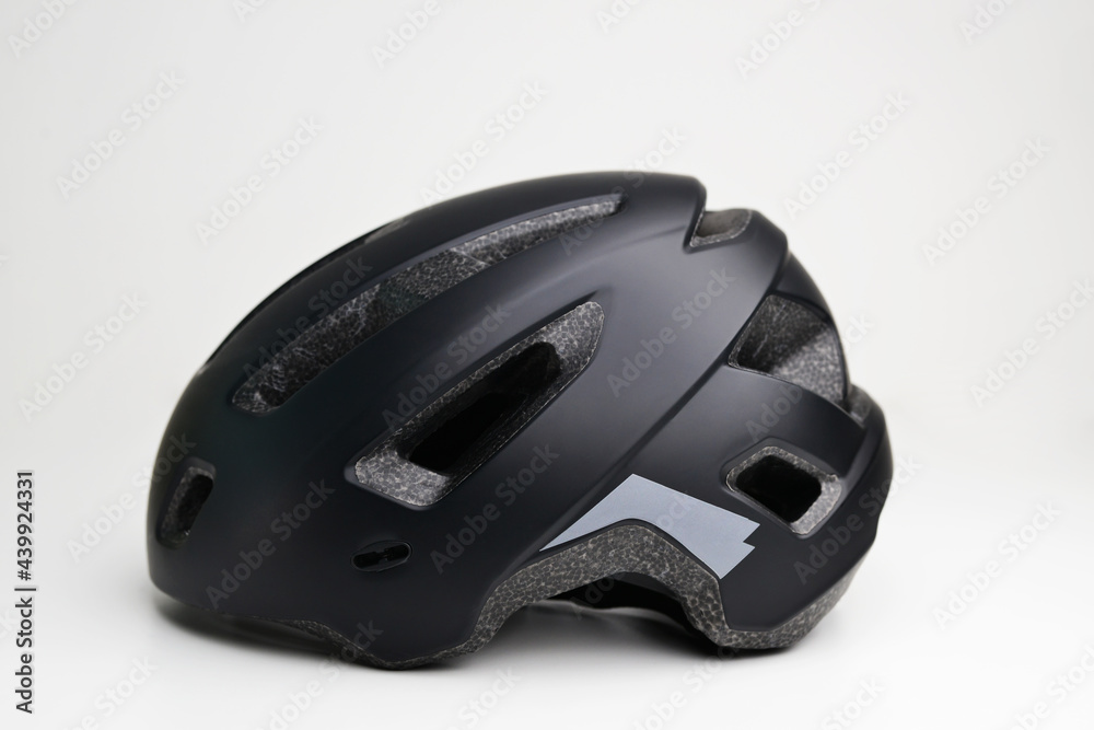 Close-up of bicycle Helmet isolated on white background. Bike helmet. Black bicycle helmet. Isolated on white, clipping path included. Close-up of bicycle Helmet isolated on white background. Bike helmet. Black bicycle helmet. Isolated on white, clipping path included.