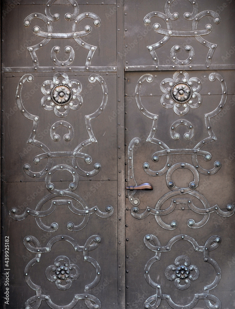 Old door with symbols and decorations in old part of town in Warsaw. Old door with symbols and decorations in old part of town in Warsaw.