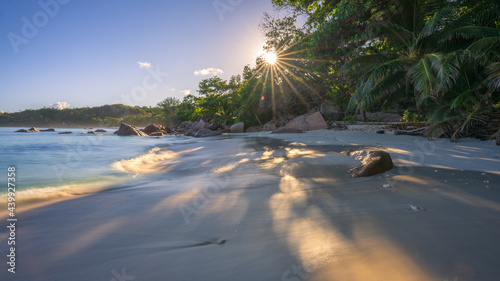 sunrise at tropical beach anse lazio on praslin on the seychelles