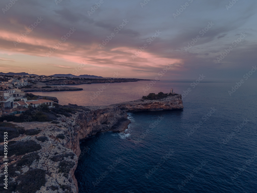 Lighthouse at the cliff in Mallorca Lighthouse at the cliff in Mallorca