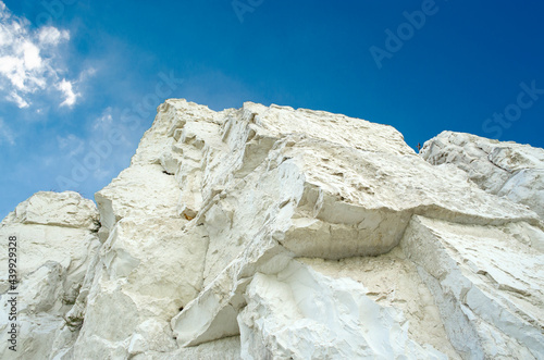 Ancient multimillion chalk mountains against the blue sky. Natural Chalk mining
