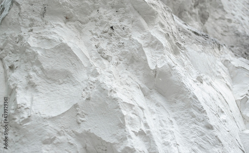 Chalk mining. Limestone quarry. Chalk hills. Chalk surface. White Stone Texture background wallpaper.