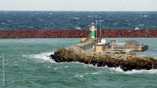 Big waves breaks against jetty