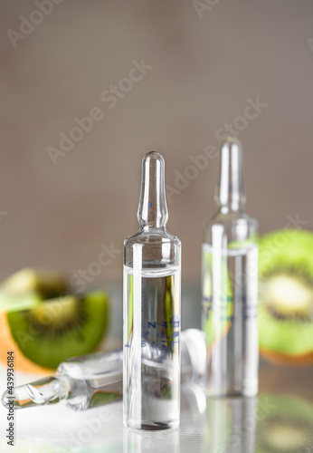 Ampoule with vitamin C for injection. Natural cosmetics concept. Organic cosmetics. Cosmetology injections.