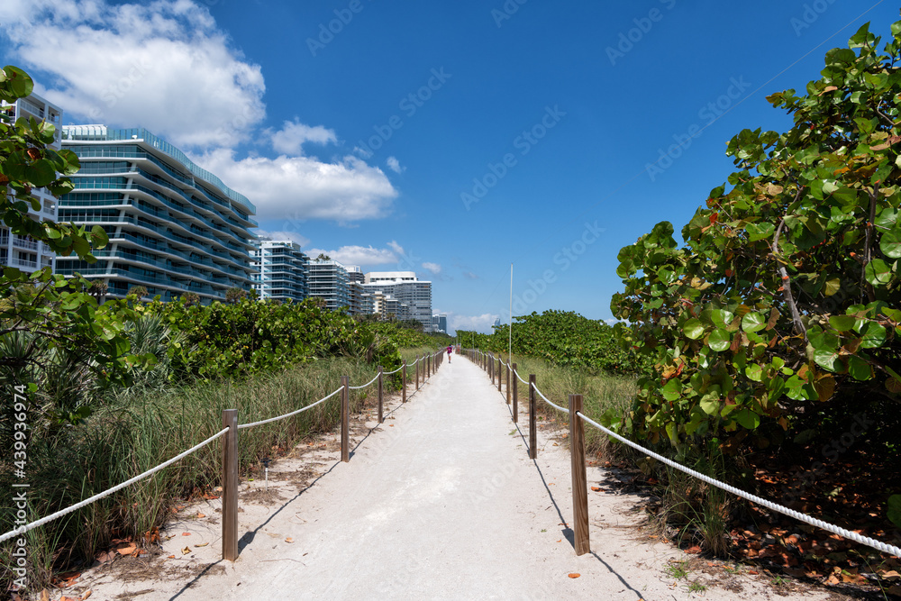 Sandy footpath in Miami, USA. Sand walking path. Summer vacation. Miami beach holidays