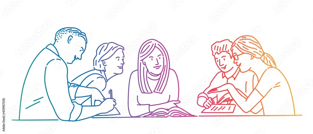 Young people working together sit at the table. Young people working together sit at the table.