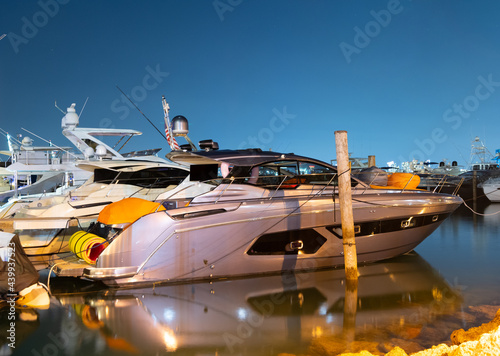 Voyage is waiting. Luxury yacht in Miami, USA. Yacht berth at dusk. Sea boat at moorage in evening