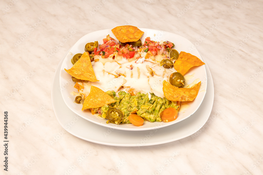 Nachos recipe with guacamole and jalapenos, avocado, pico de gallo