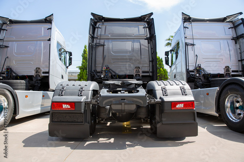 Backside of new heavy trucks in truck store