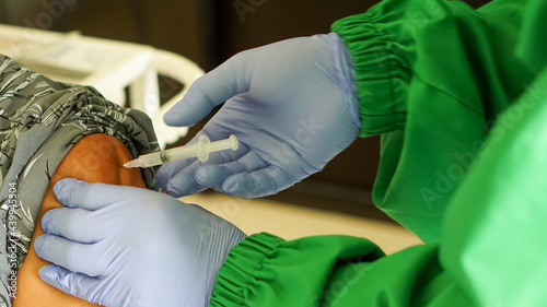 medical staff inject virus vaccine to the patient for immunization