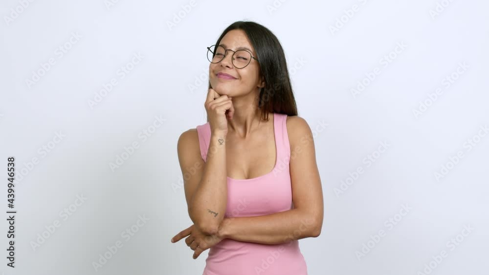 Young woman with glasses standing and thinking over isolated background Young woman with glasses standing and thinking over isolated background