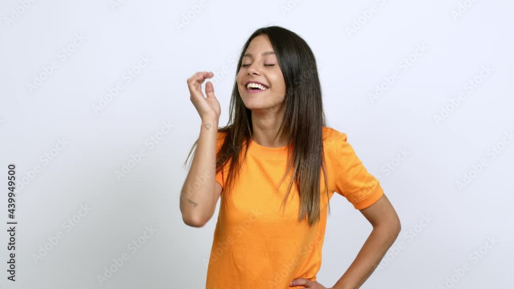 Young woman intending to realizes the solution while lifting a finger up over isolated background Young woman intending to realizes the solution while lifting a finger up over isolated background