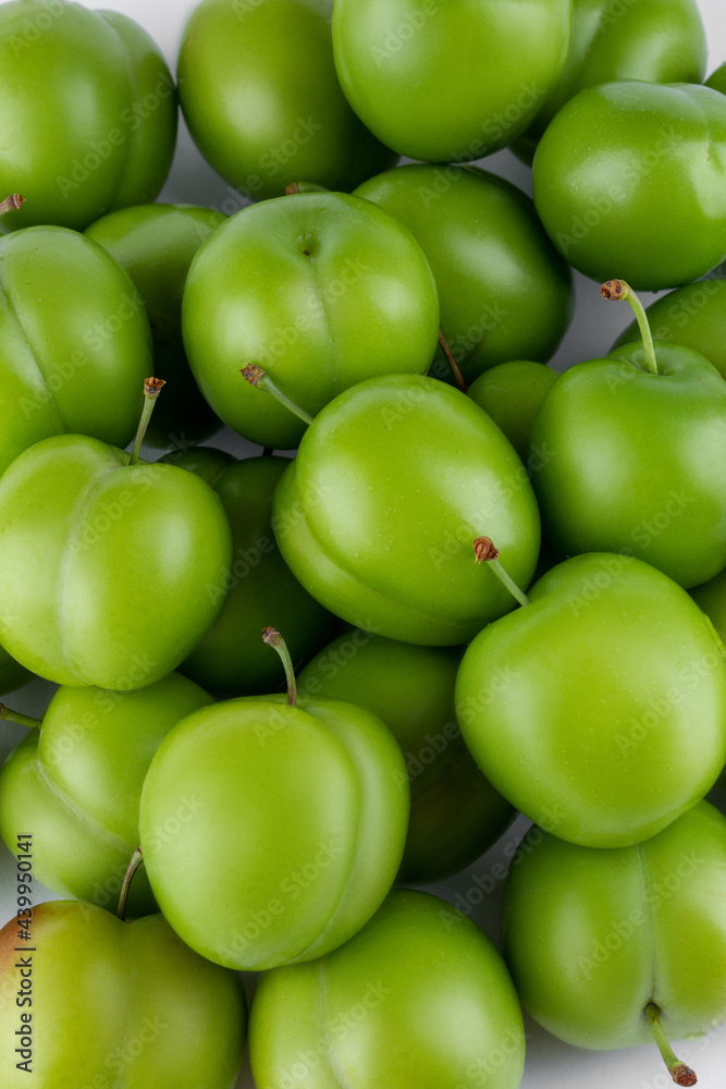 fresh and green plum on white background fresh and green plum on white background