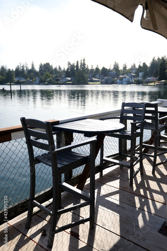 Waterfront outdoor patio seating with a round bar table