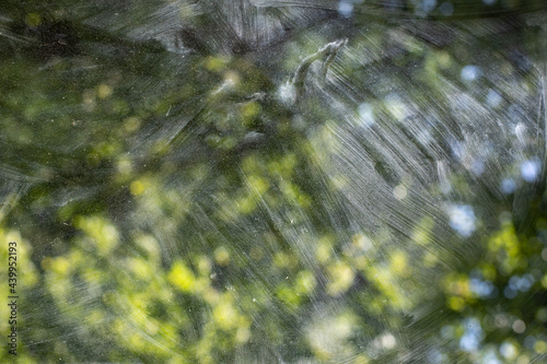 Dirty glass. Washing the window. The transparent glass is covered with dust.