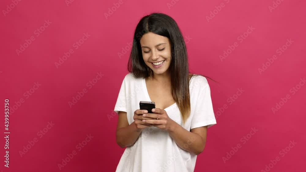 Young woman using mobile phone over isolated background Young woman using mobile phone over isolated background