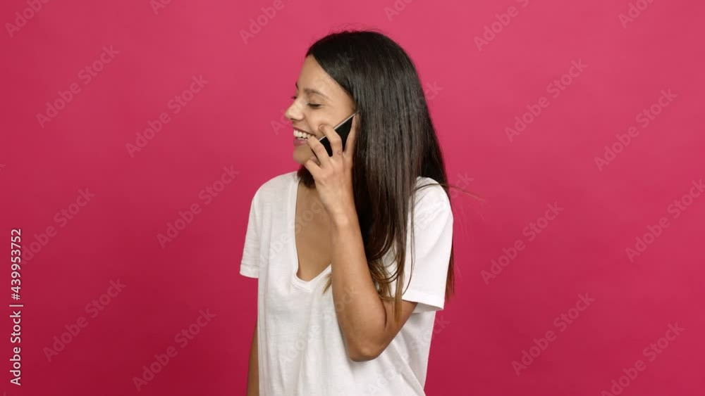 Young woman using mobile phone over isolated background Young woman using mobile phone over isolated background