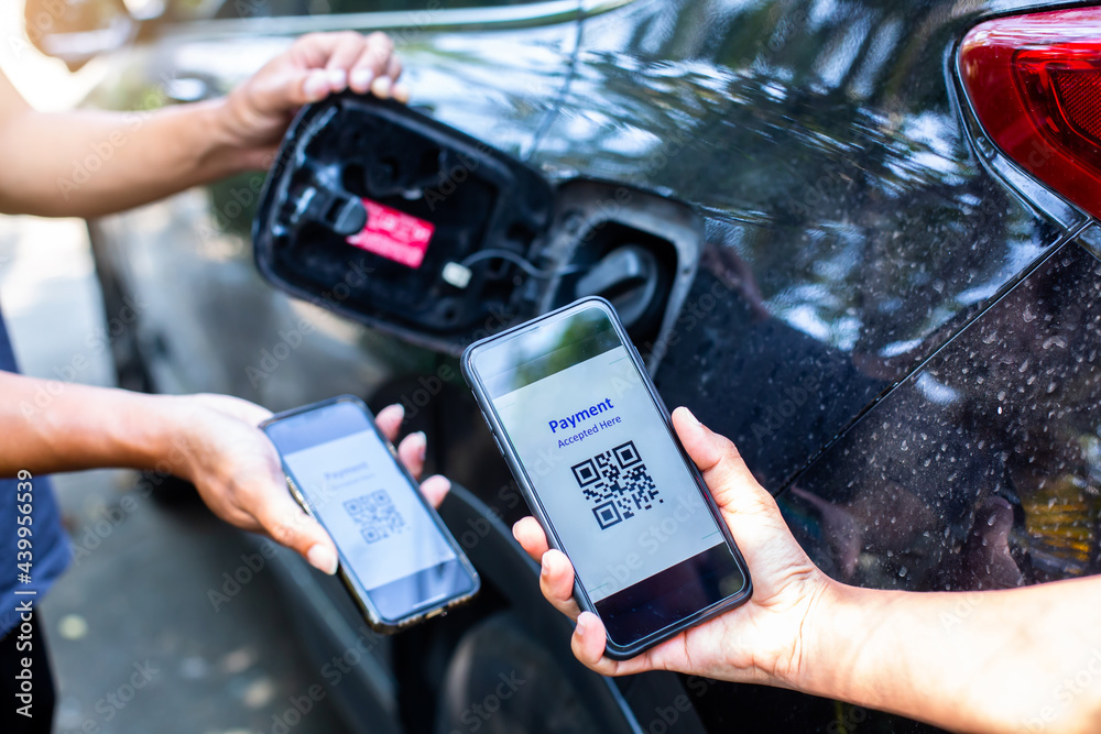 Selective focus to Hand using smart phone to scan QR code tag with