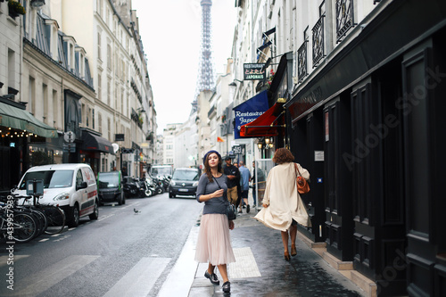 Beautiful girl walking in romantic paris
