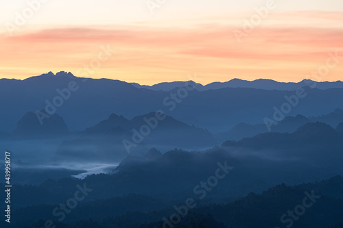 Beautiful Landscape of mountain layer in morning sun ray and winter fog at Mae Hong Son, Thailand
