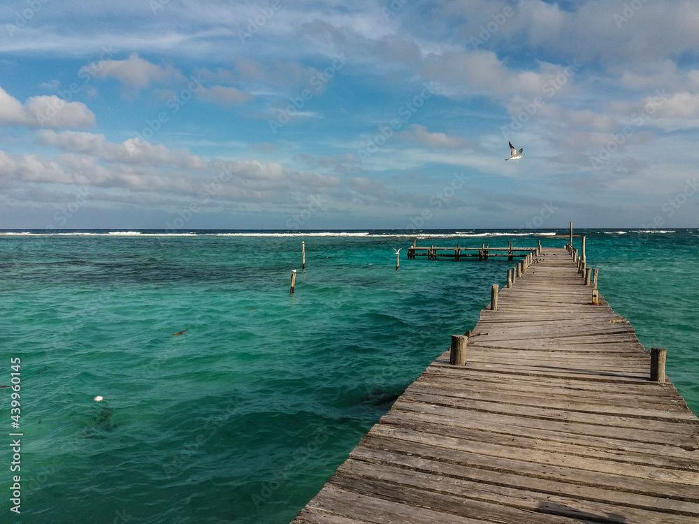 Fototapeta premium Pier at the seashore in virgin beach