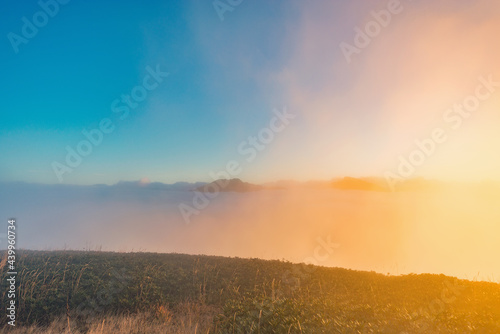 Clouds above the mountains at sunset. Caucasus.