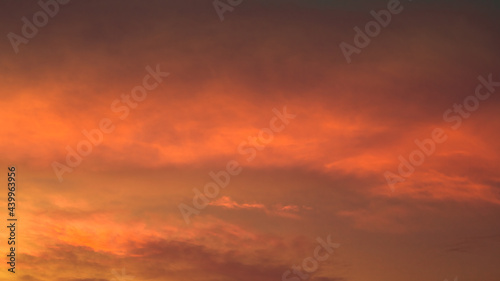 Highly blurred background from the residence,with a panoramic view of the city(condominium,office,home offices,houses,football fields,bridges across the river) and colorful colors from the evening sky