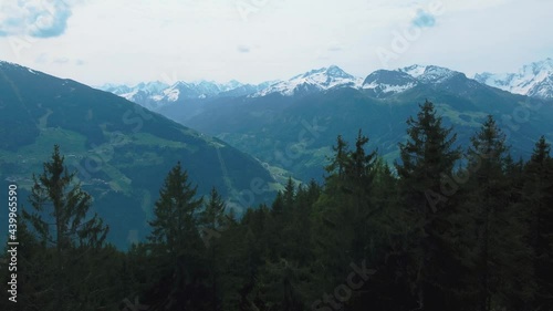 Aerial drone above a forest and trees in nature at scenic Zillertal skiing sport hiking and trekking vacation mountain valley in the Austrian Bavarian alps on a sunny lush summer day. photo