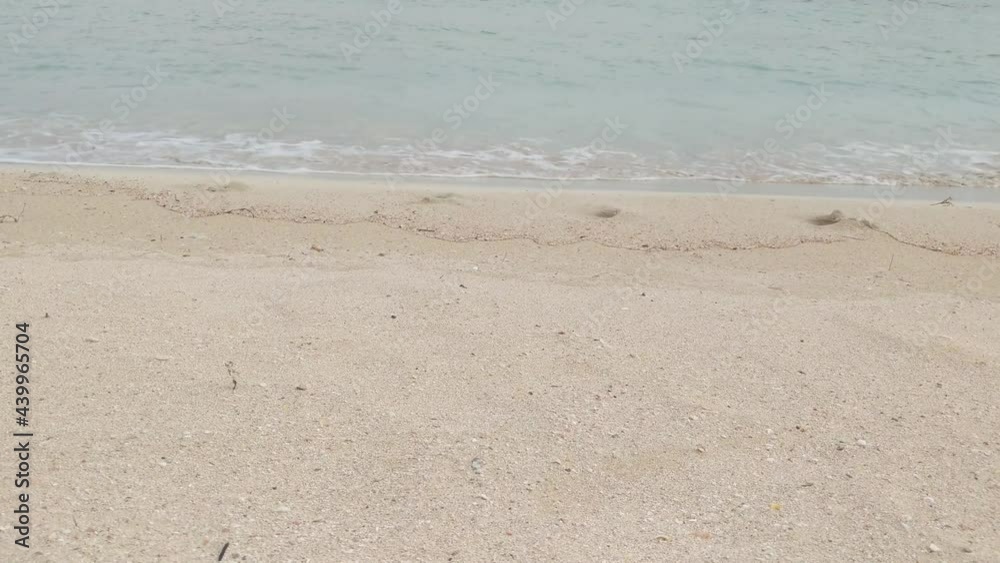 Close-up of sandy beach with soft waves in Pretty Bay, Birzebbuga, Malta 4K Close-up of sandy beach with soft waves in Pretty Bay, Birzebbuga, Malta 4K