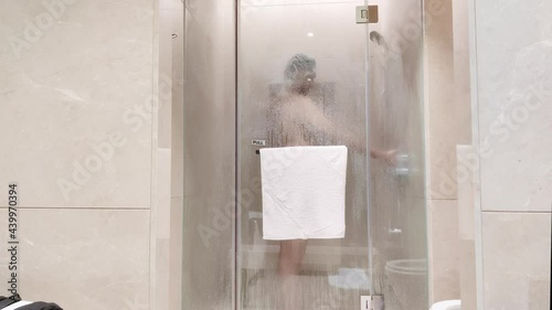 Young Asian Boy Bathing, washing head in shower in bathroom | Young Asian Boy in shower washing hair behind foggy bathroom glass | Shower, Bathing, Interior, clean, concept photo