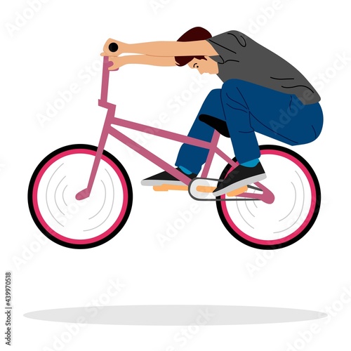 Young boy showing off freestyle trick with bicycle