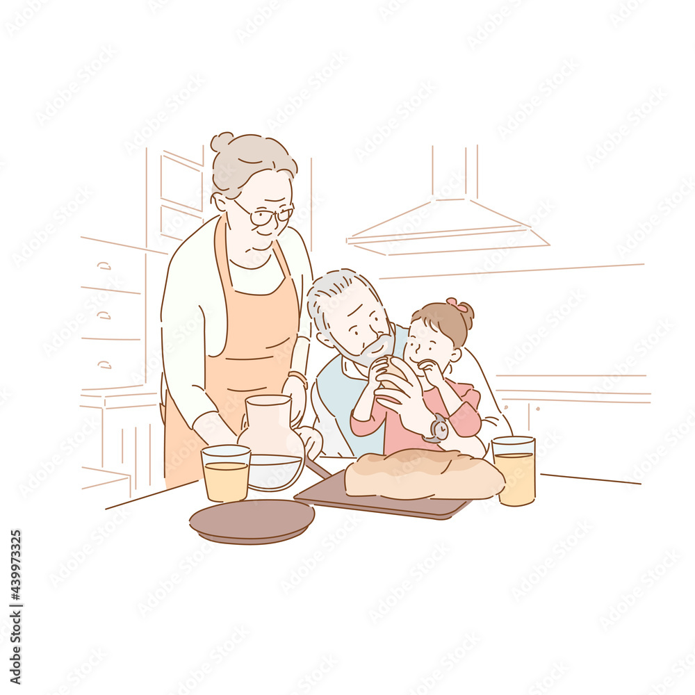 Obraz premium An elderly couple is feeding their granddaughter food.