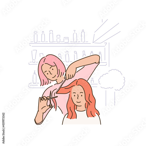 A female hairdresser is cutting a custoemr's hair.