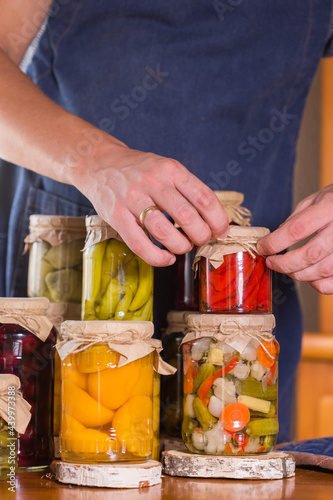 Young man holding in hands preserved food