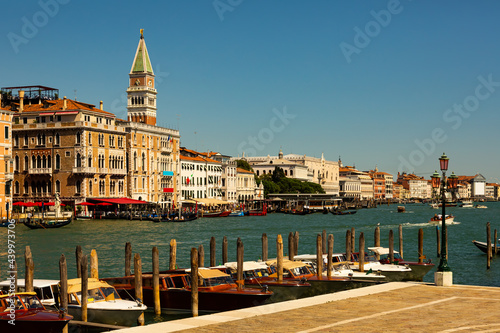 Scenic view of Venetian Grand Canal with old colorful architecture of central districts and St Mark Campanile in sunny day, Italy © JackF