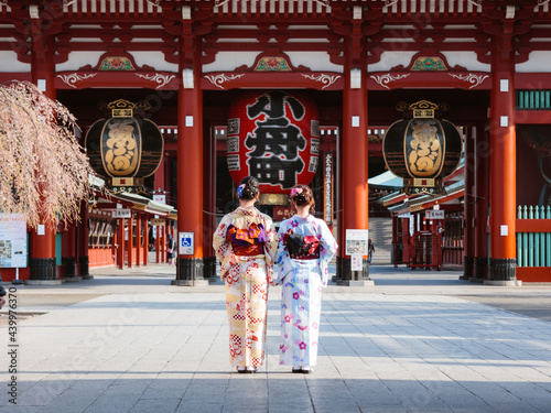 Women in kimono at the entrance of Sensoji temple, Asakusa, Tokyo, Japan photo