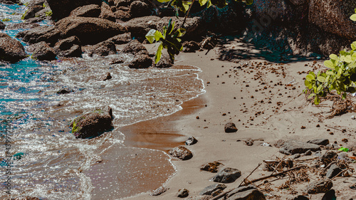 Image of rock formations (stones), with texture and sharpness, on the beach during the day photo