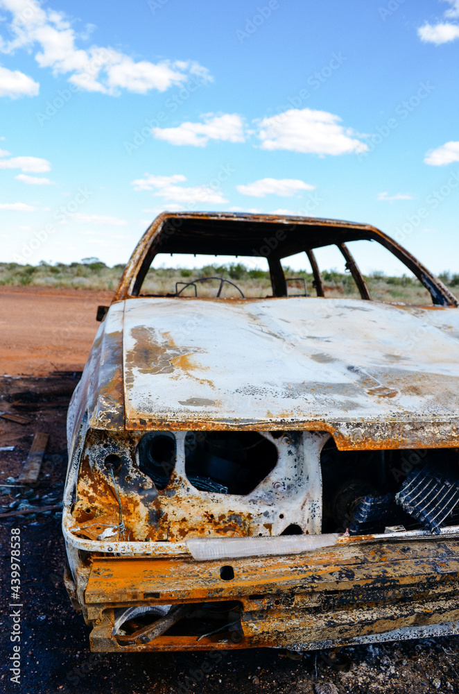 Abandoned rusted car in the desert
