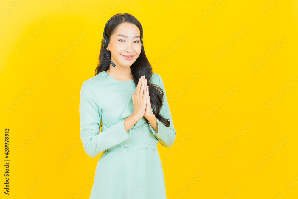 Portrait beautiful young asian woman with call center customer care service center Portrait beautiful young asian woman with call center customer care service center