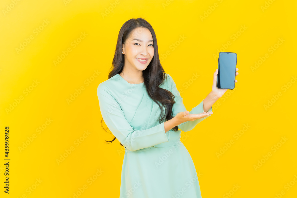 Portrait beautiful young asian woman smile with smart mobile phone Portrait beautiful young asian woman smile with smart mobile phone