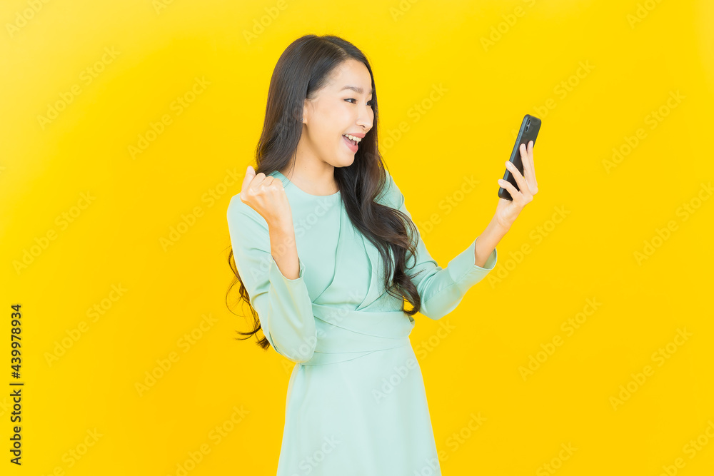 Portrait beautiful young asian woman smile with smart mobile phone Portrait beautiful young asian woman smile with smart mobile phone