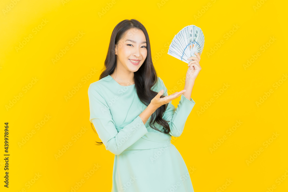 Portrait beautiful young asian woman smile with a lot of cash and money Portrait beautiful young asian woman smile with a lot of cash and money