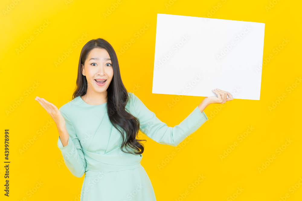 Portrait beautiful young asian woman with empty white billboard Portrait beautiful young asian woman with empty white billboard