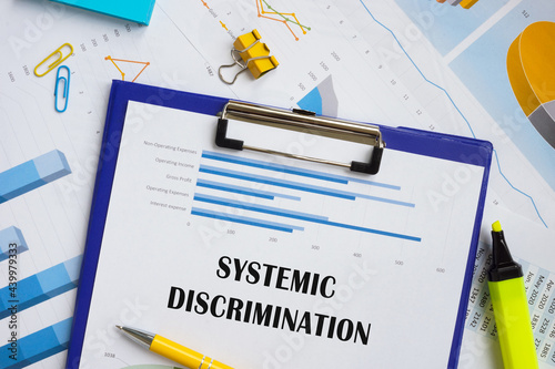 Business concept meaning Systemic Discrimination with inscription on the piece of paper. photo