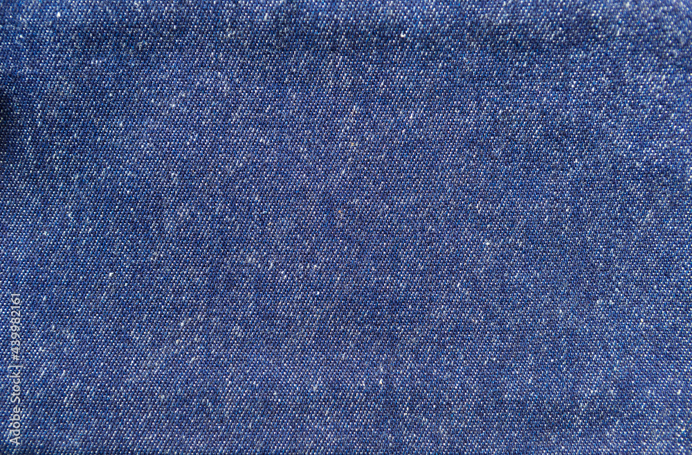 Naklejka premium Blue jean fabric texture background, blank blue fabric pattern background