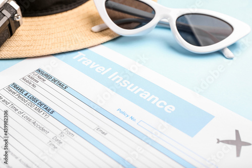 Composition with travel insurance and sunglasses on color background, closeup