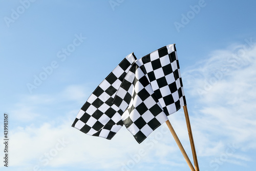 Racing flags against blue sky © Pixel-Shot