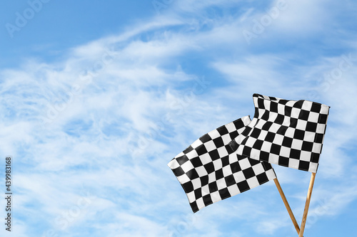 Racing flags against blue sky © Pixel-Shot