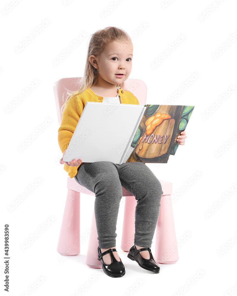 Cute little girl with book on white background Cute little girl with book on white background